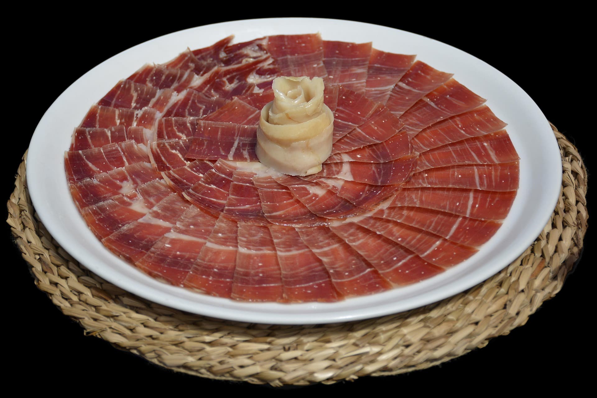 Sliced cured ham on a board