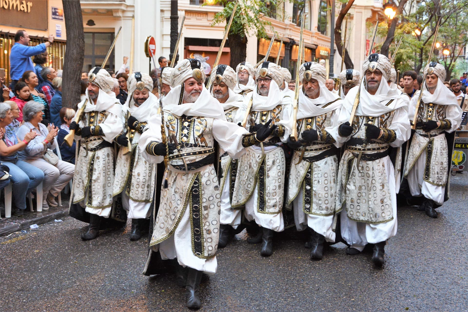 A parade crowd in Valencia, the scale of Fallas week